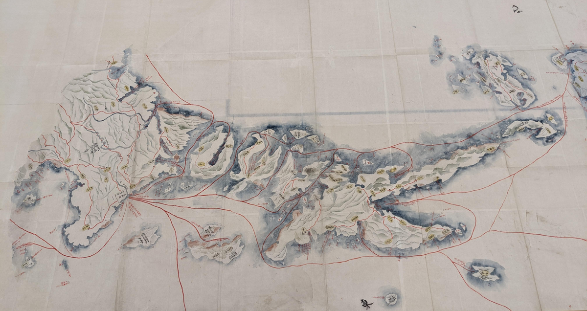 A historical map of the Goto islands with a faint blue color indicating the waters edge.