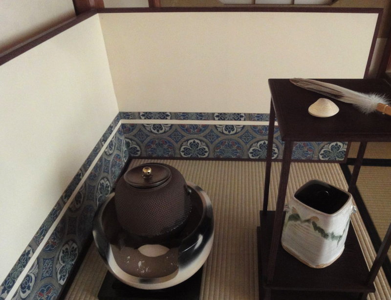 A two-panel hinged screen, about 2.5 feet high, placed around the brazier and kettle, cold water container, and other tea utensils in one corner of the tatami room.