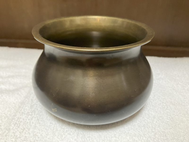 Burnished brass "efugo" (hawk's feeding bowl) shape rinse-water container. The bowl's sides flare then narrow then widen again at the upper edge.