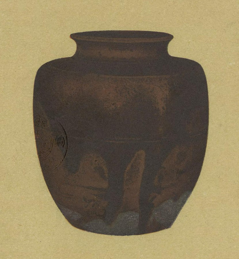 A print of a round tea caddy with a textured brown surface.